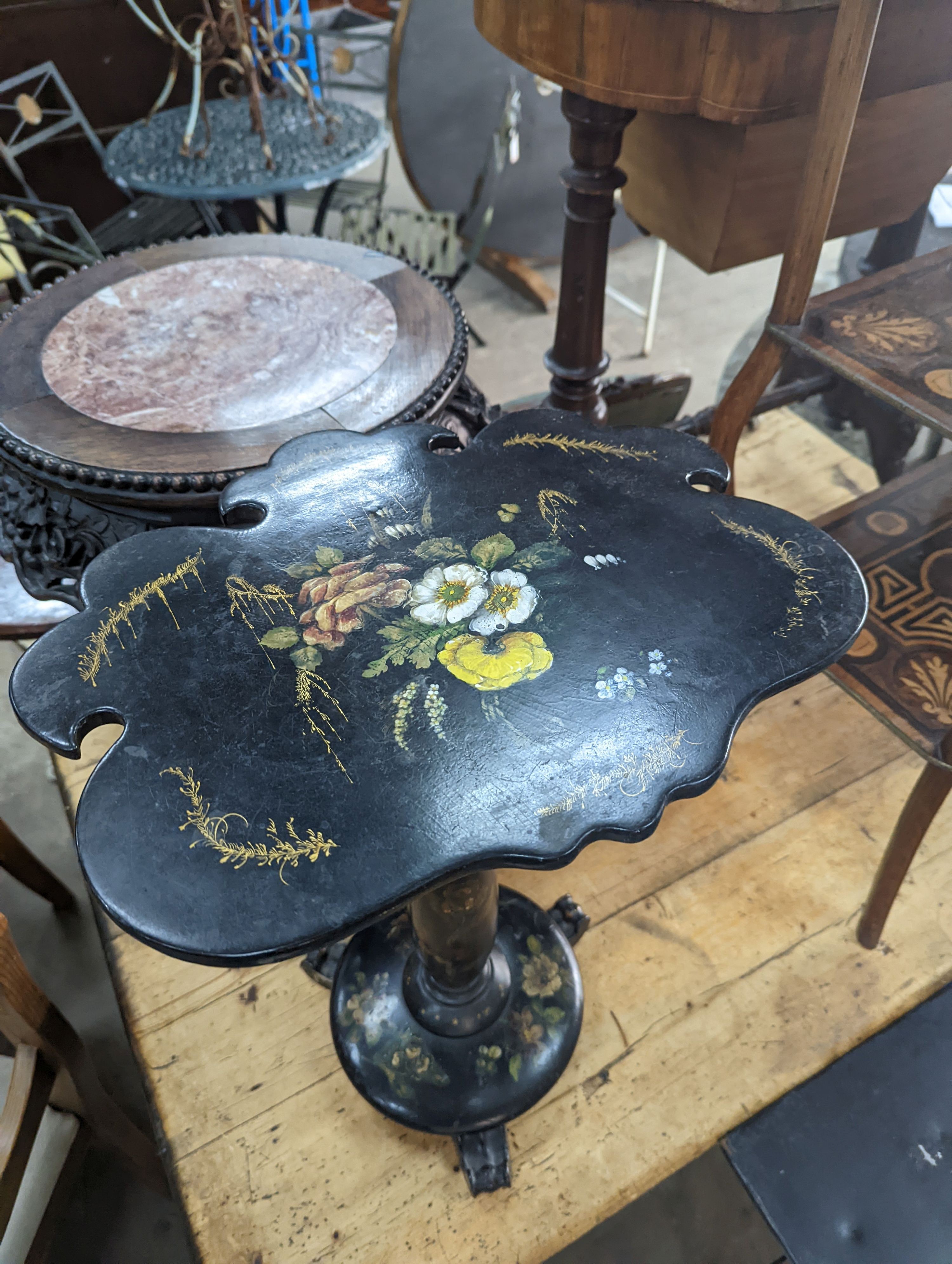 A Victorian floral painted papier mache occasional table, with a shaped oval top (converted from a pole screen), width 40cm, depth 33cm, height 53cm